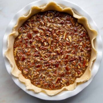 unbaked crisco pie crust filled with a pecan filling.