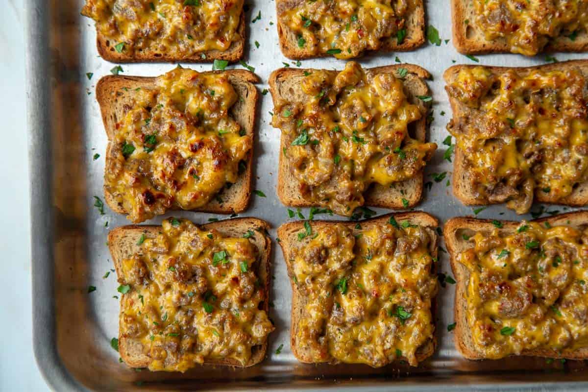 9 broiled hanky panky appetizers on a baking sheet.
