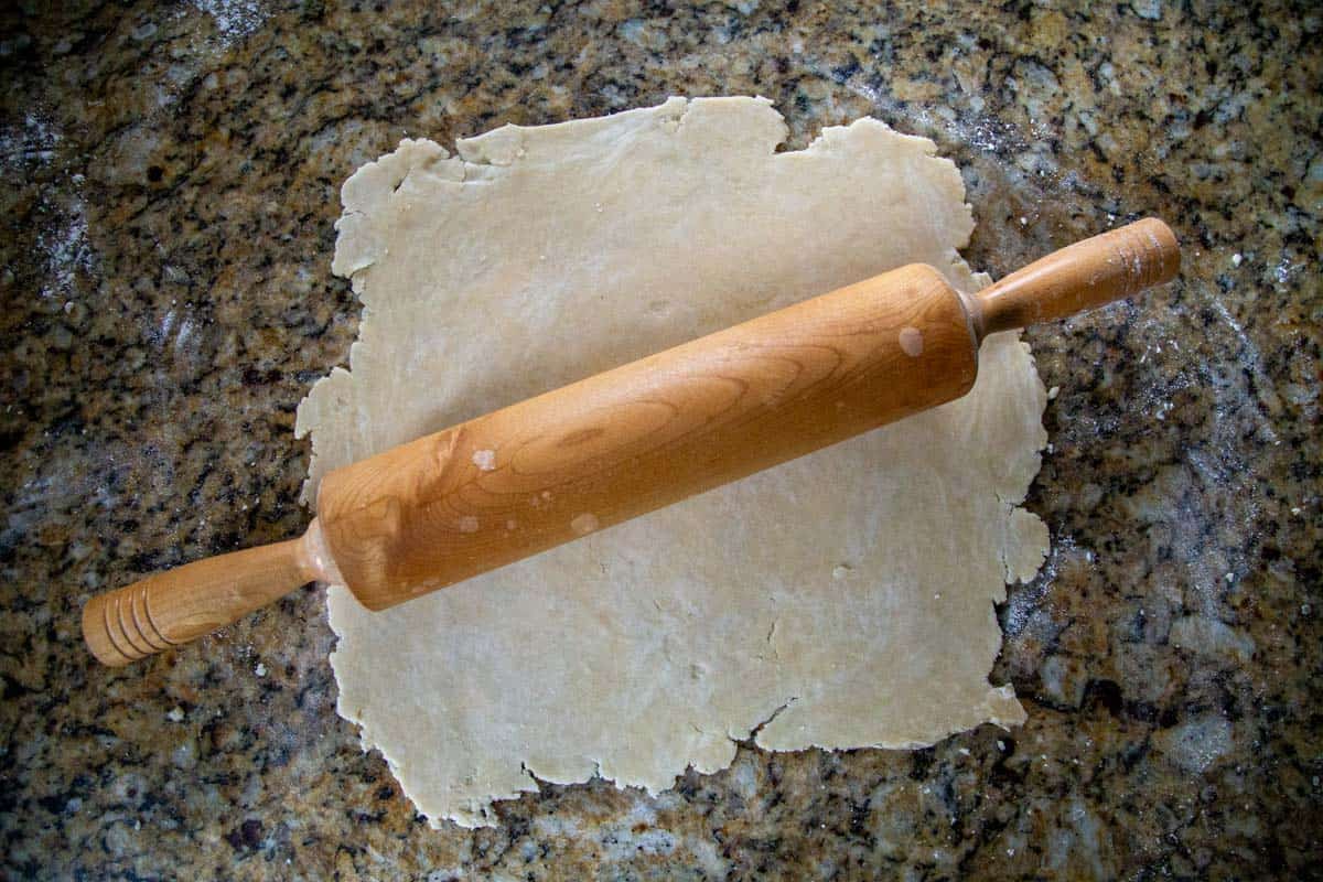 rolled out crisco pie crust on a countertop.