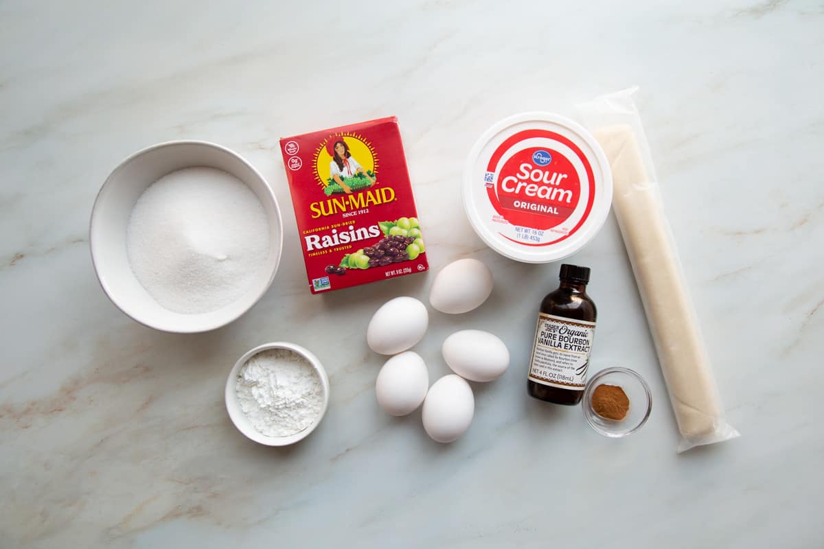 ingredients for a sour cream raisin pie.