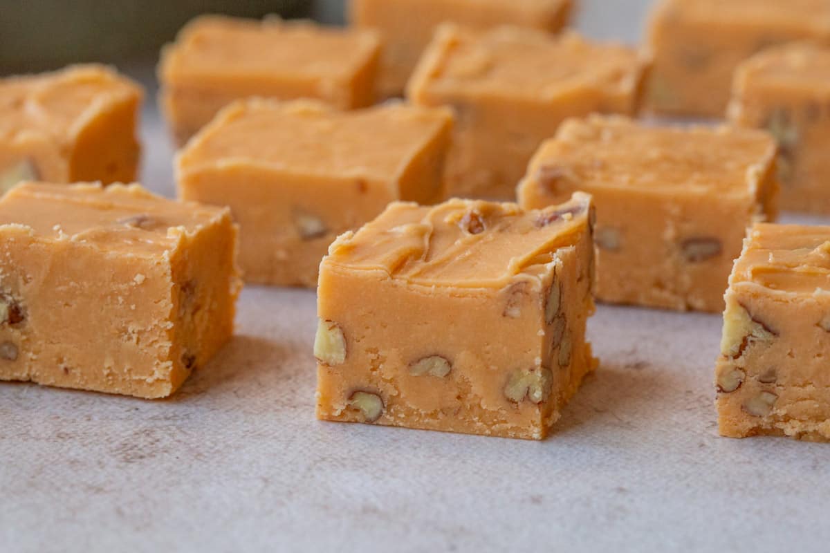 pieces of butterscotch fudge with pecans inside.