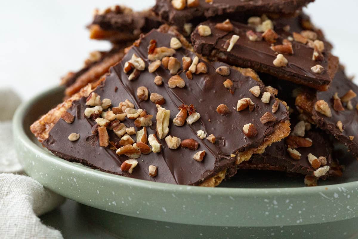 saltine cracker candy on a light green tray.