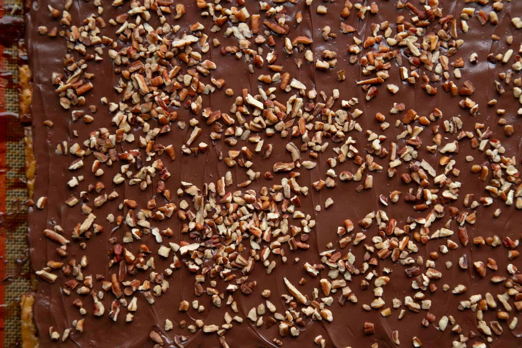 saltine cracker candy sprinkled with chopped pecans on top.