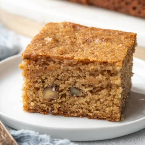 slice of applesauce cake on a white plate.