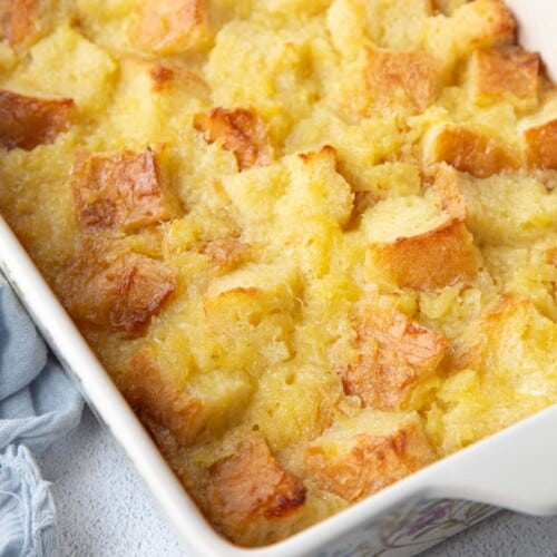 scalloped pineapple in a white casserole dish.