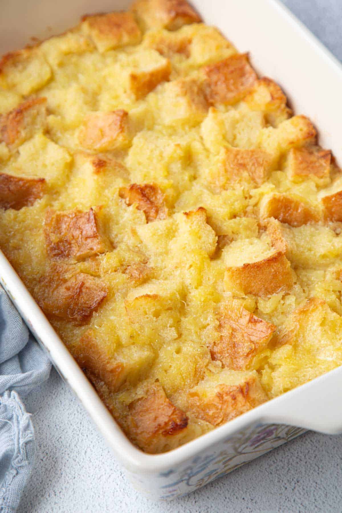 white casserole dish filled with scalloped pineapple.