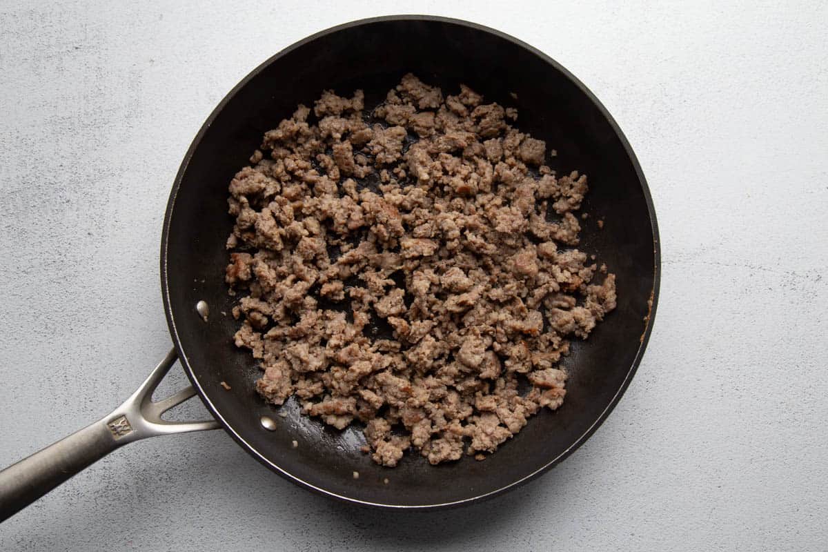 crumbled sausage in a skillet.