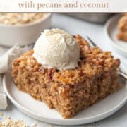 slice of old fashioned oatmeal cake with a scoop of vanilla ice cream on top.