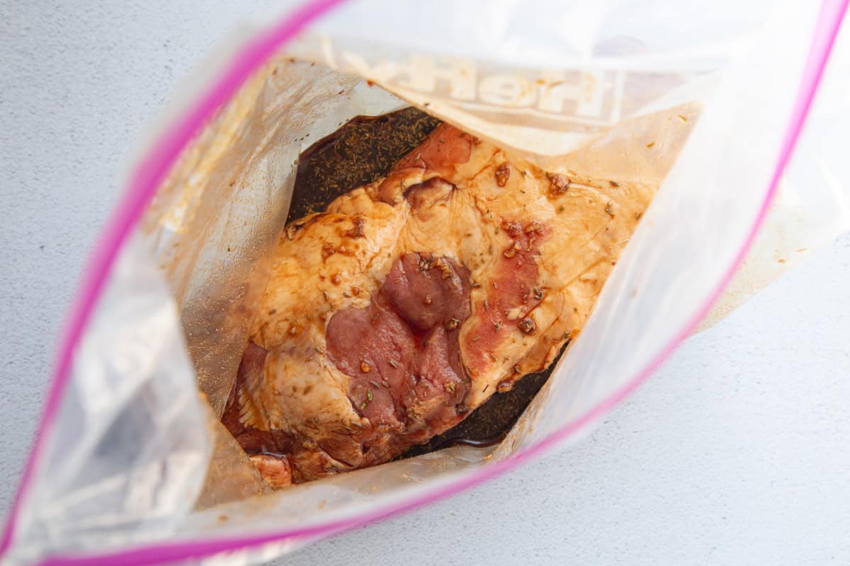 pork roast marinating in a bag. 