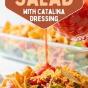 salad with tomatoes, beans, and fritos, with catalina dressing being poured over the top.