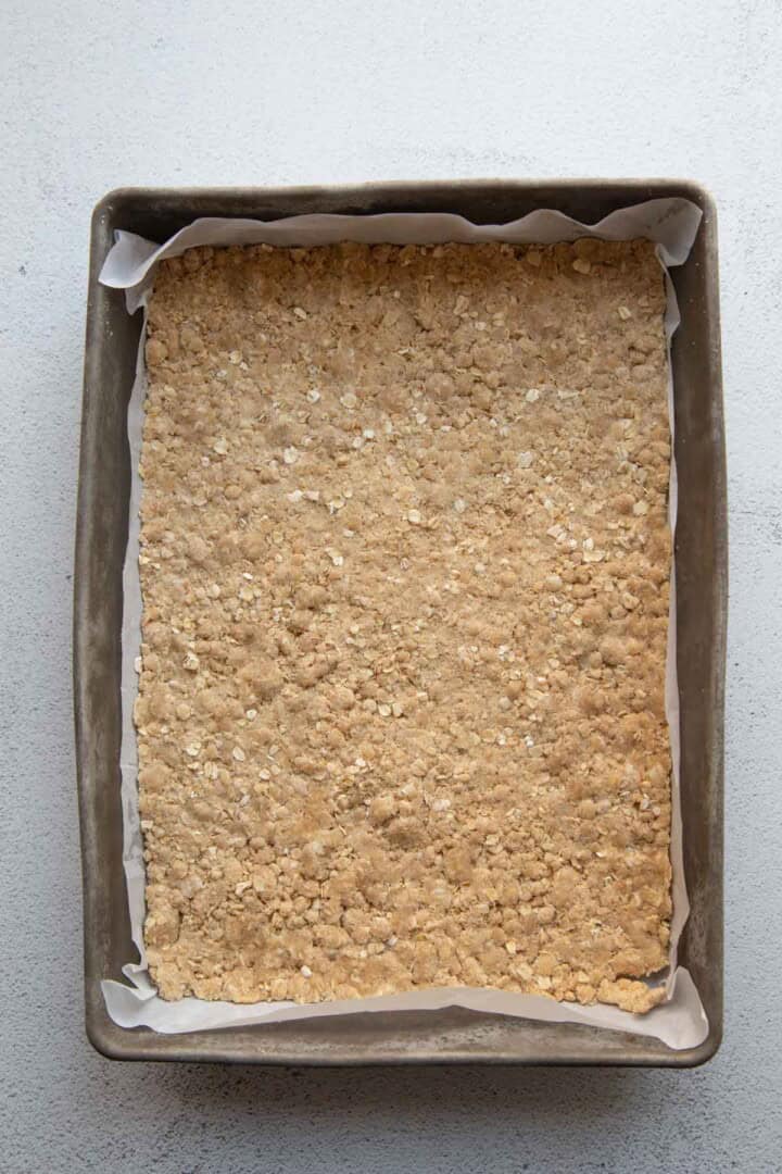 oatmeal crumble in a metal dish.