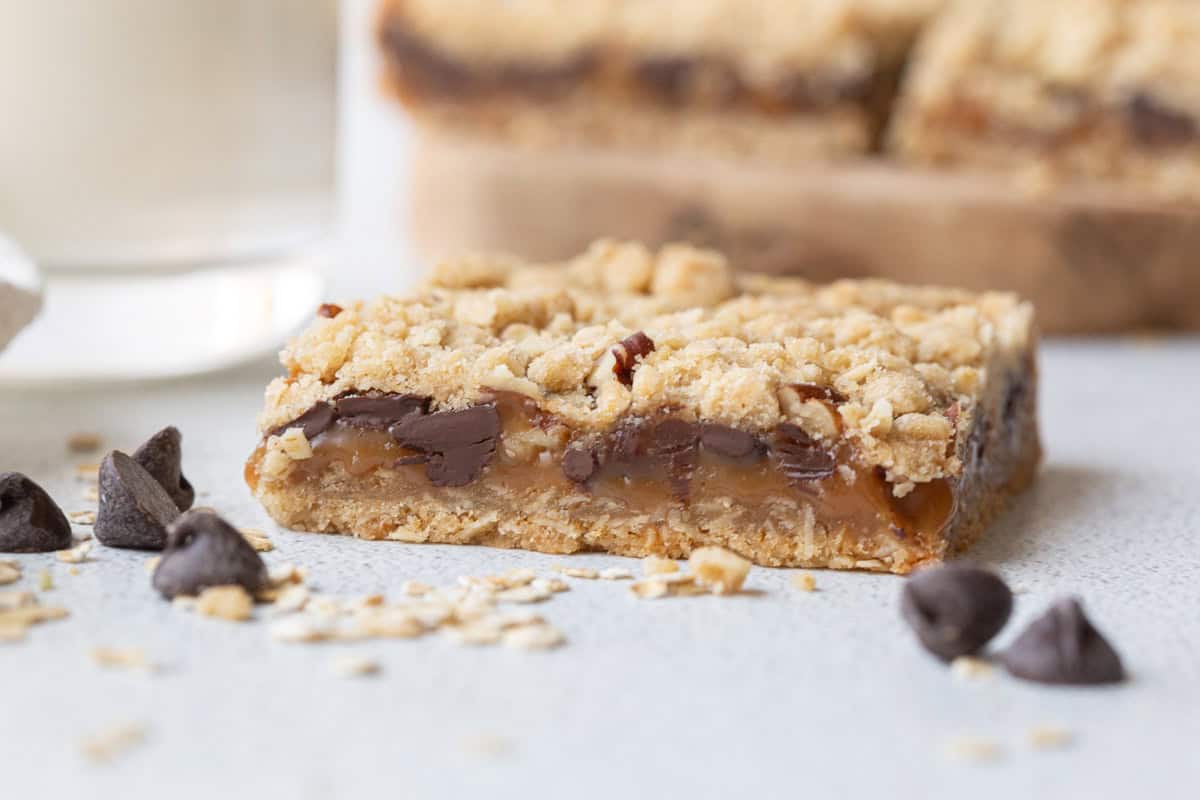 an oatmeal caramelita with chocolate chips and oats.