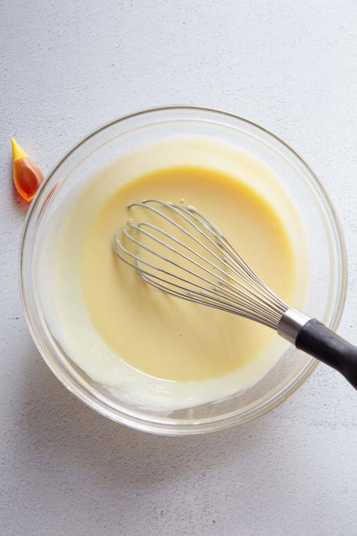 sweetened condensed milk mixture in a glass bowl.