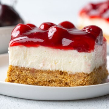 slice of cherry delight with cherry pie filling on top.