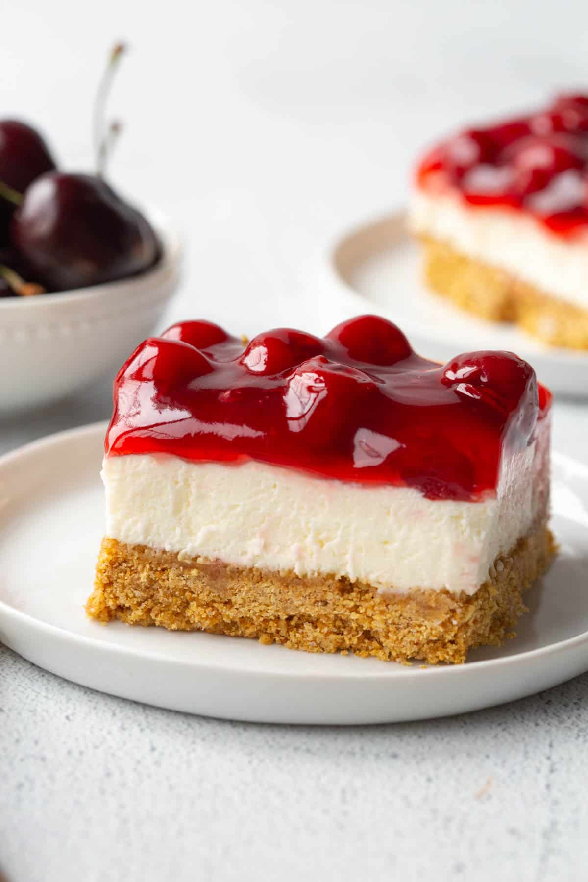 slice of cherry delight on a white plate.