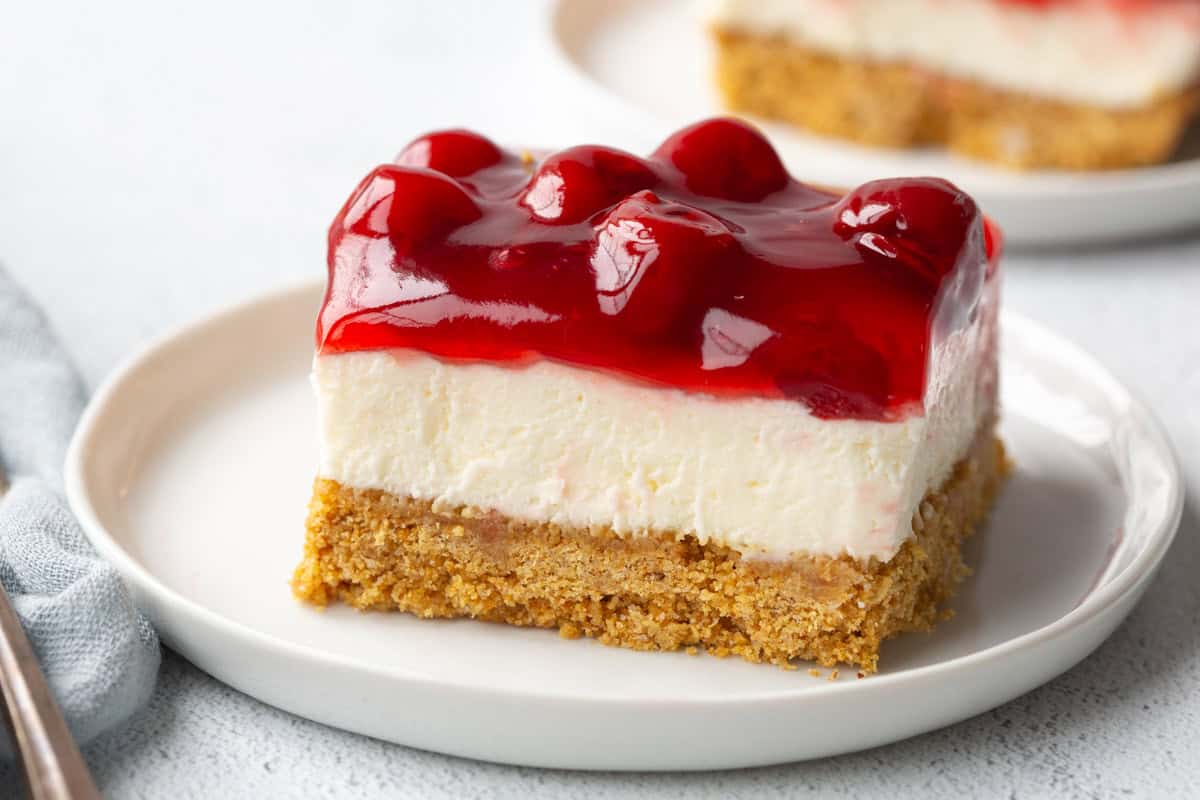 slice of cherry delight on a white plate.