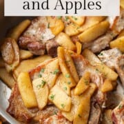 pork chops with apple slices in a skillet.