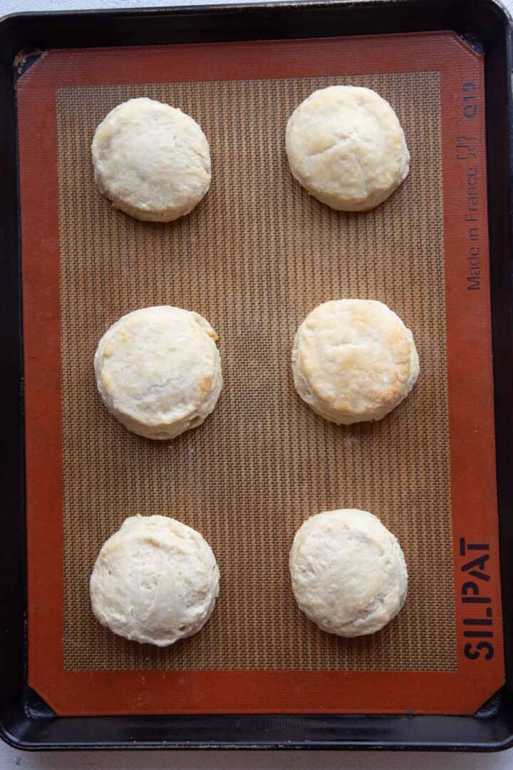 cooked shortcakes on a baking mat.