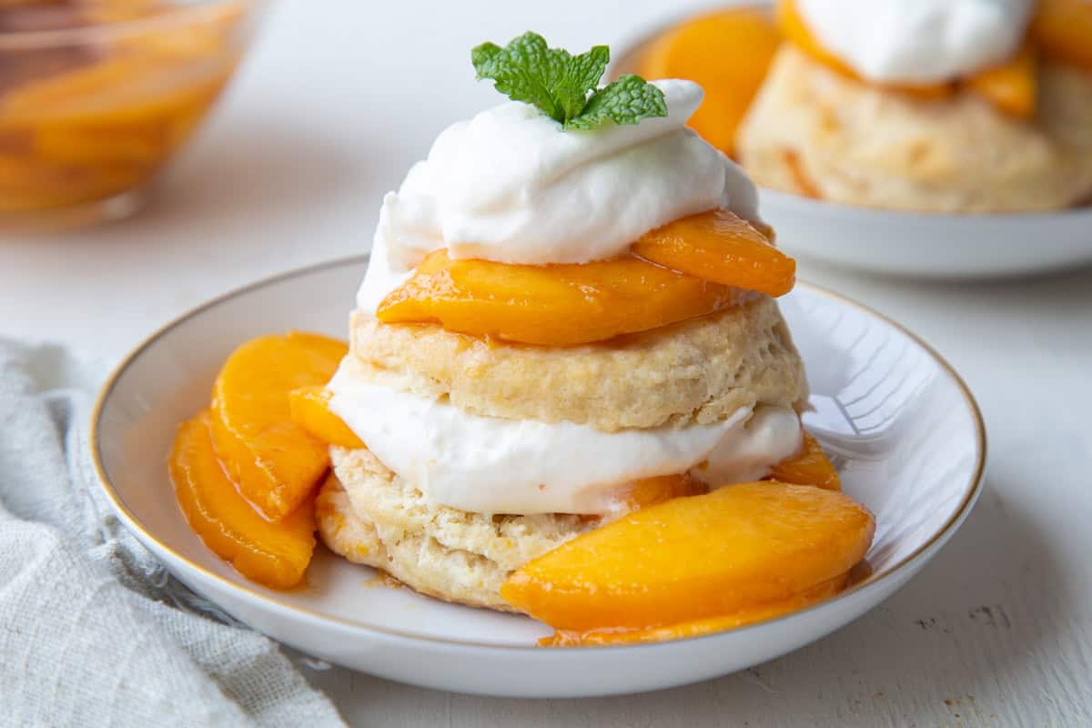 peach shortcake layered with whipped cream.