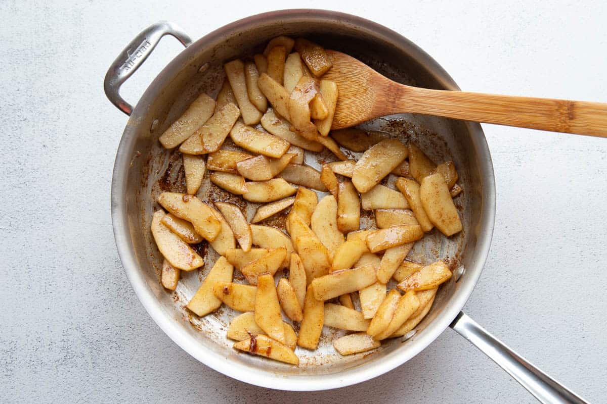sautéed apples in a skillet.