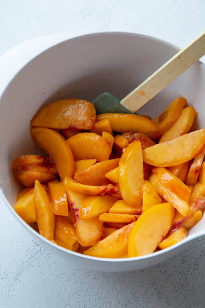 sliced peaches in a bowl.