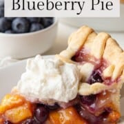 Peach Blueberry Pie slice with whipped cream.