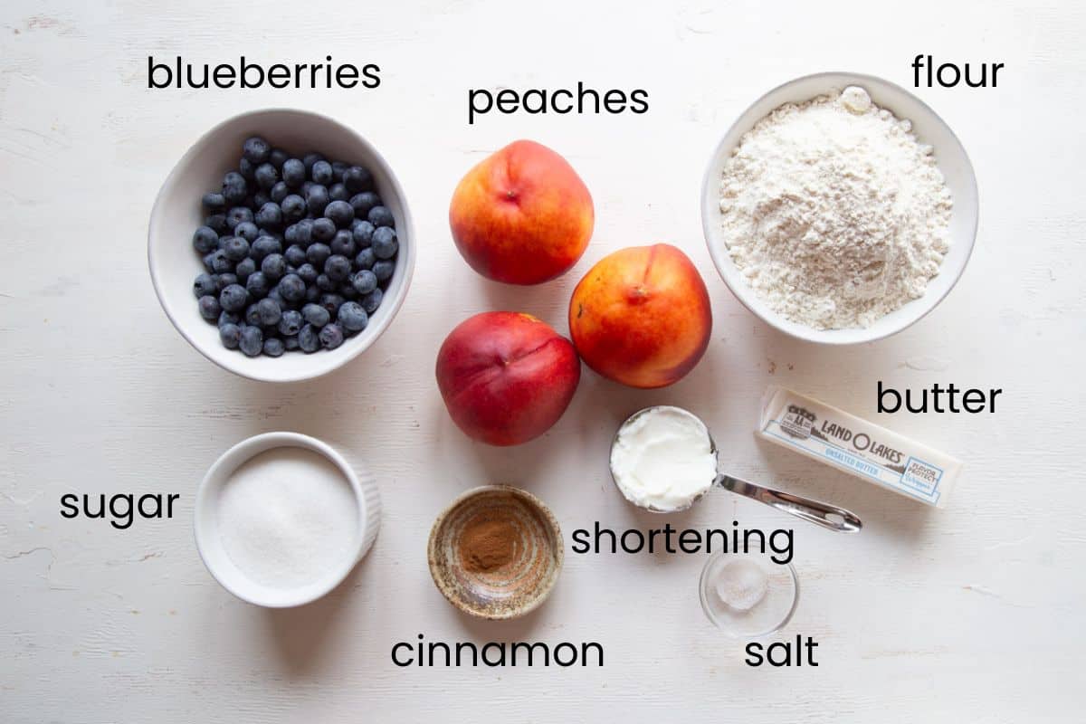peaches, blueberries, flour, sugar, and other ingredients.