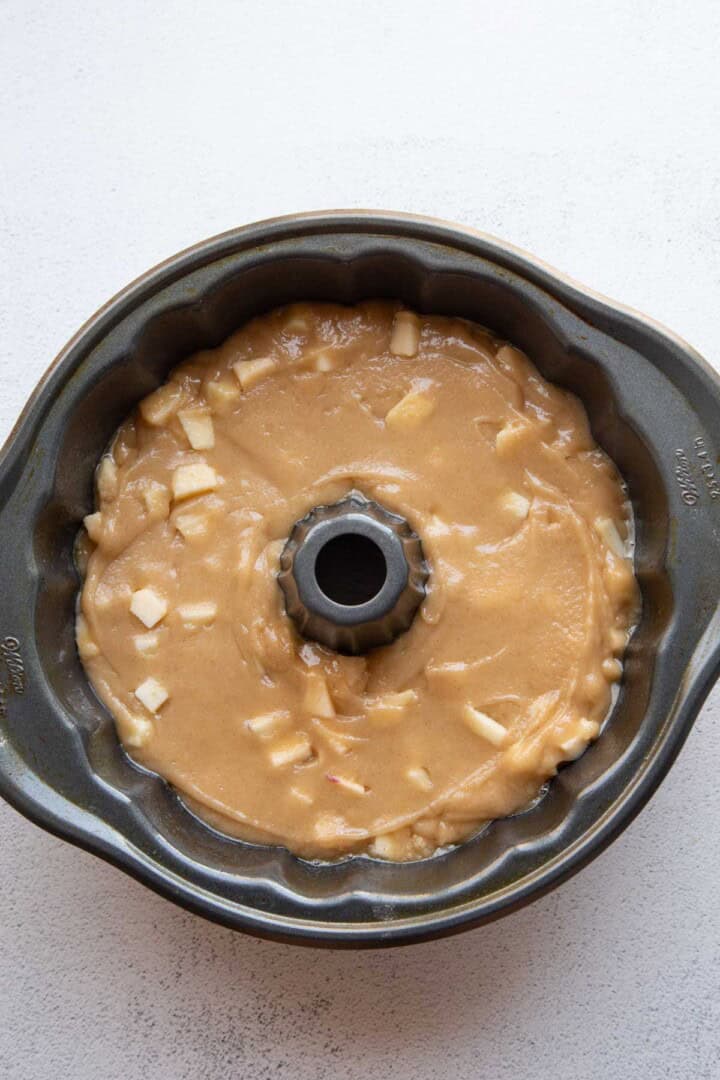 apple cake batter in a bundt pan.