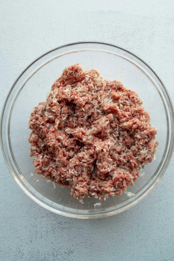 ground beef and rice mixture in a glass bowl.