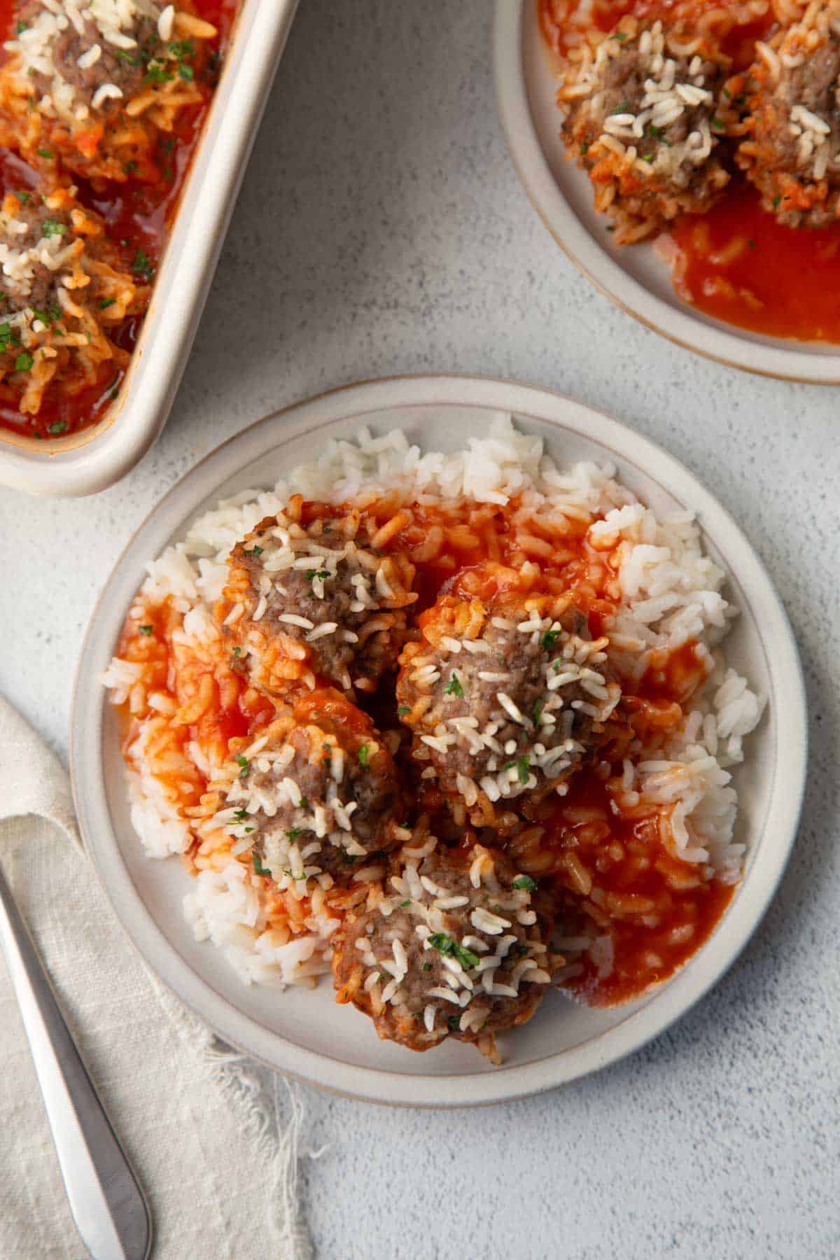 porcupine meatballs in tomato sauce over rice.
