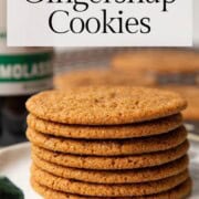 gingersnaps stacked on a plate.