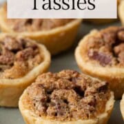 pecan tassies on a green pedestal platter.