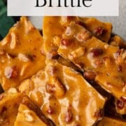 old fashioned peanut brittle in a white dish.