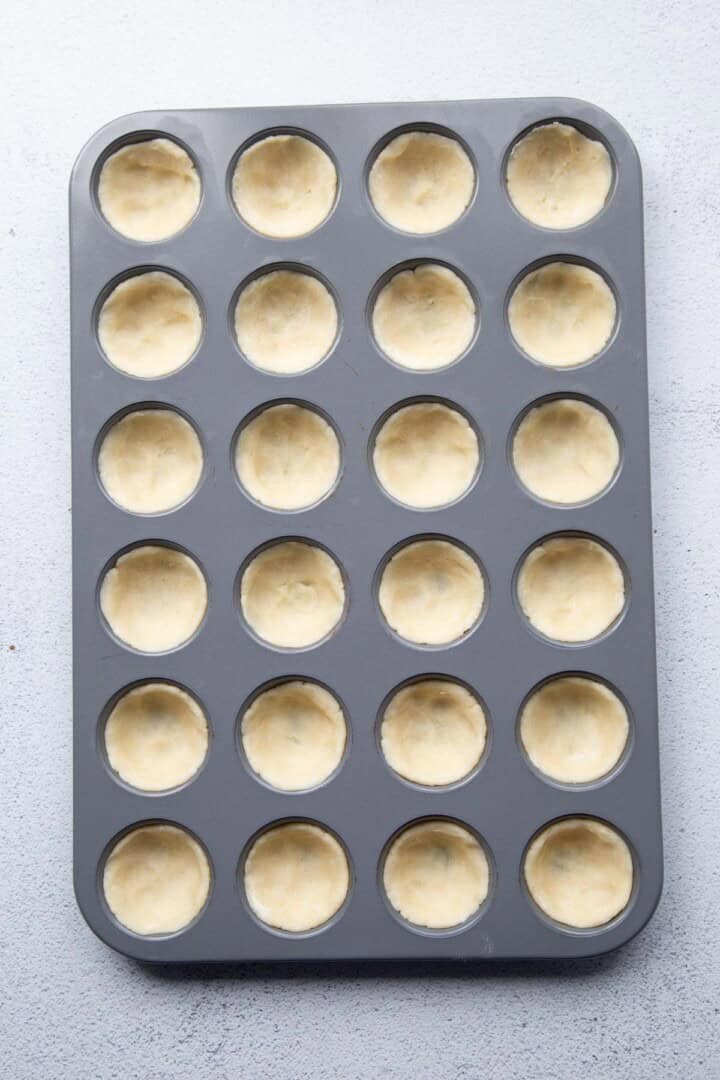 dough in a mini muffin cup.