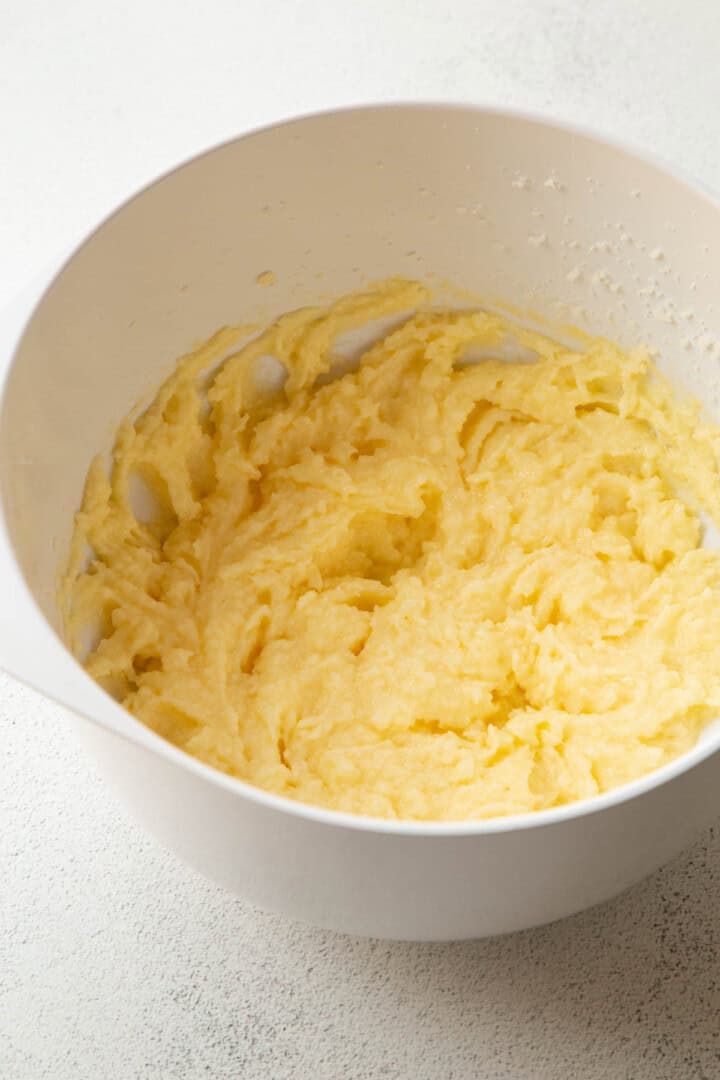 butter, sugar, and egg in a white bowl.