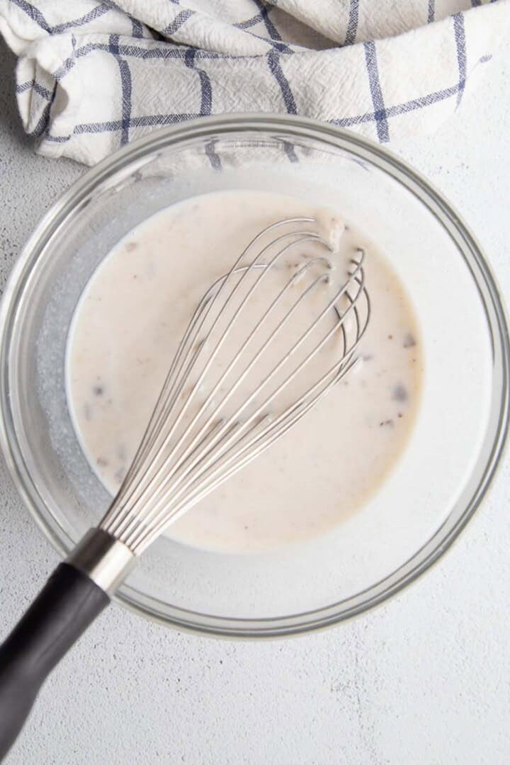 cream of mushroom soup in a glass bowl.