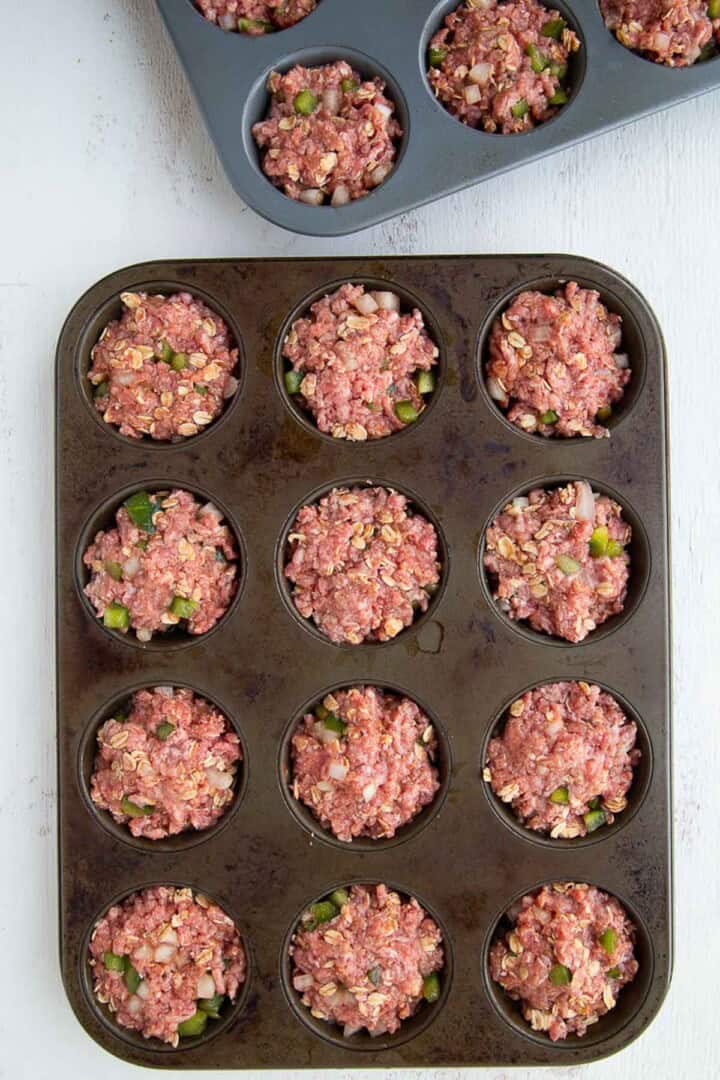 meatloaf in the wells of a muffin pan.