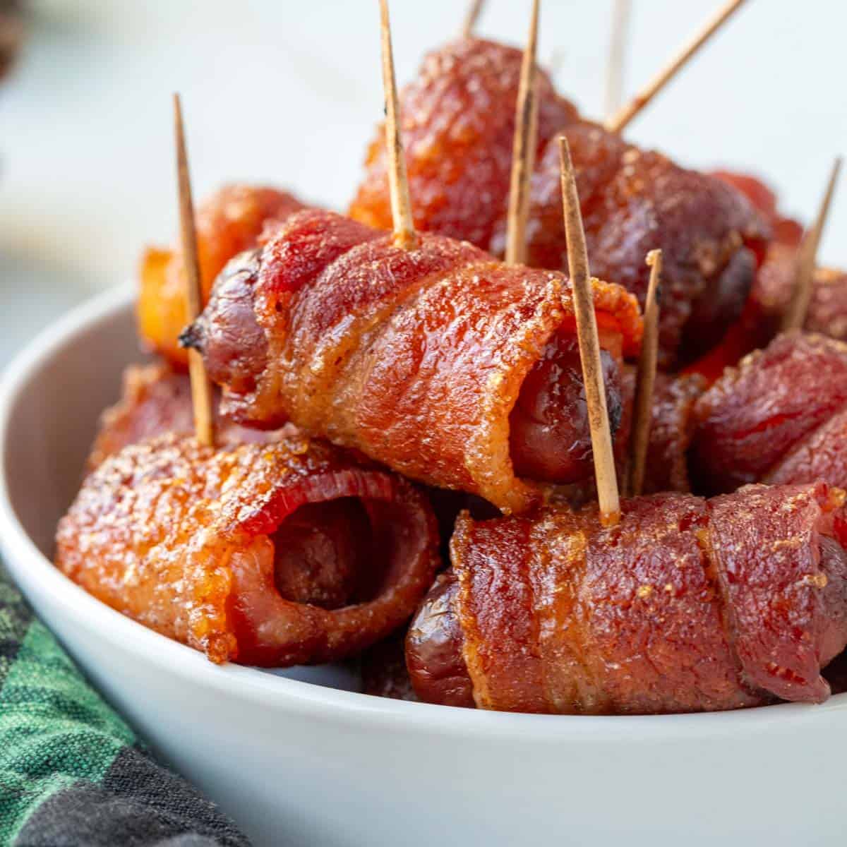 bacon wrapped smokies with toothpicks.
