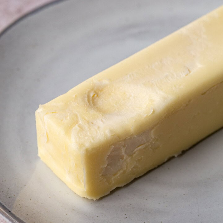 stick of butter with a fingerprint indented into it.