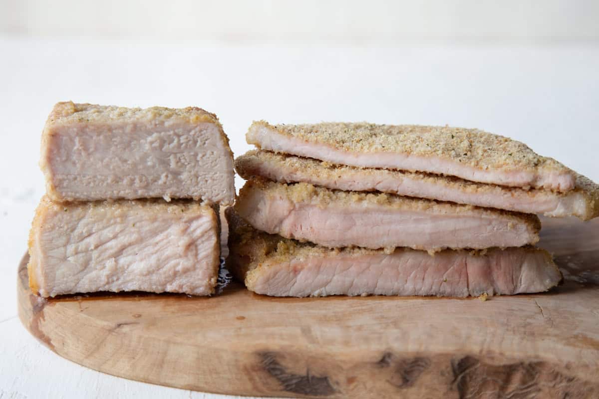 pork chops cut open to show a blush of pink in the center.