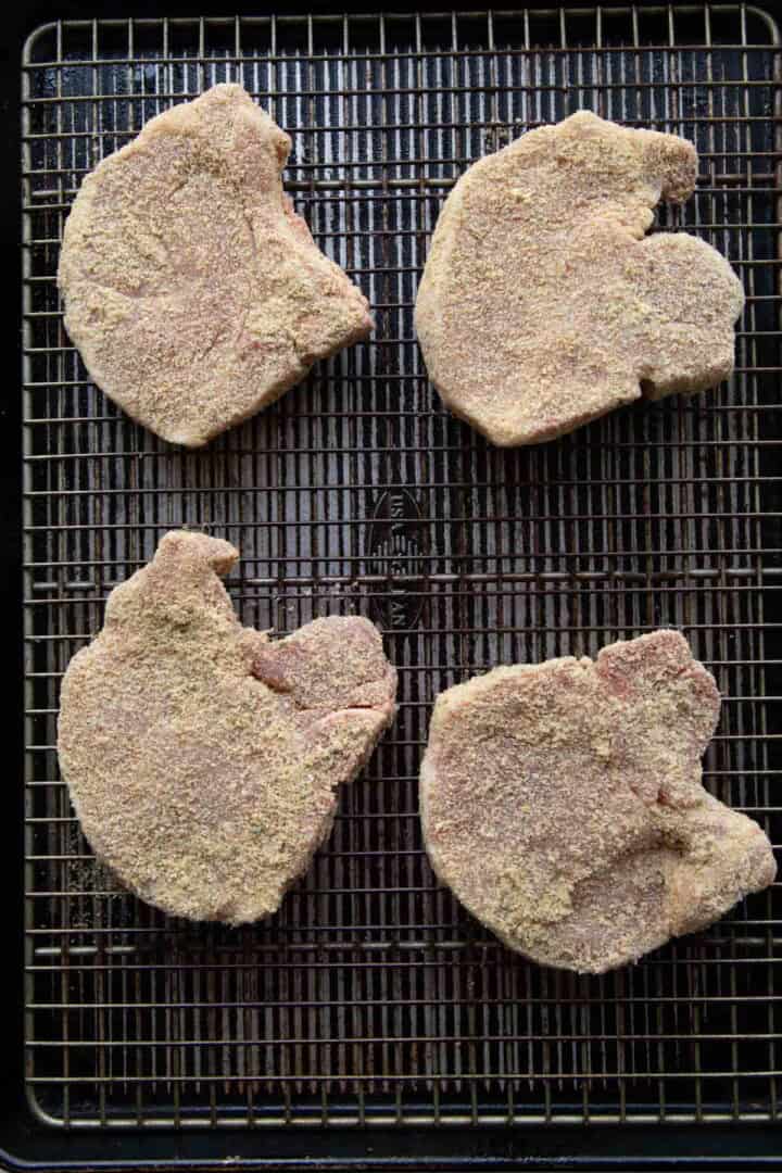 unbaked pork chops coated in shake and bake.