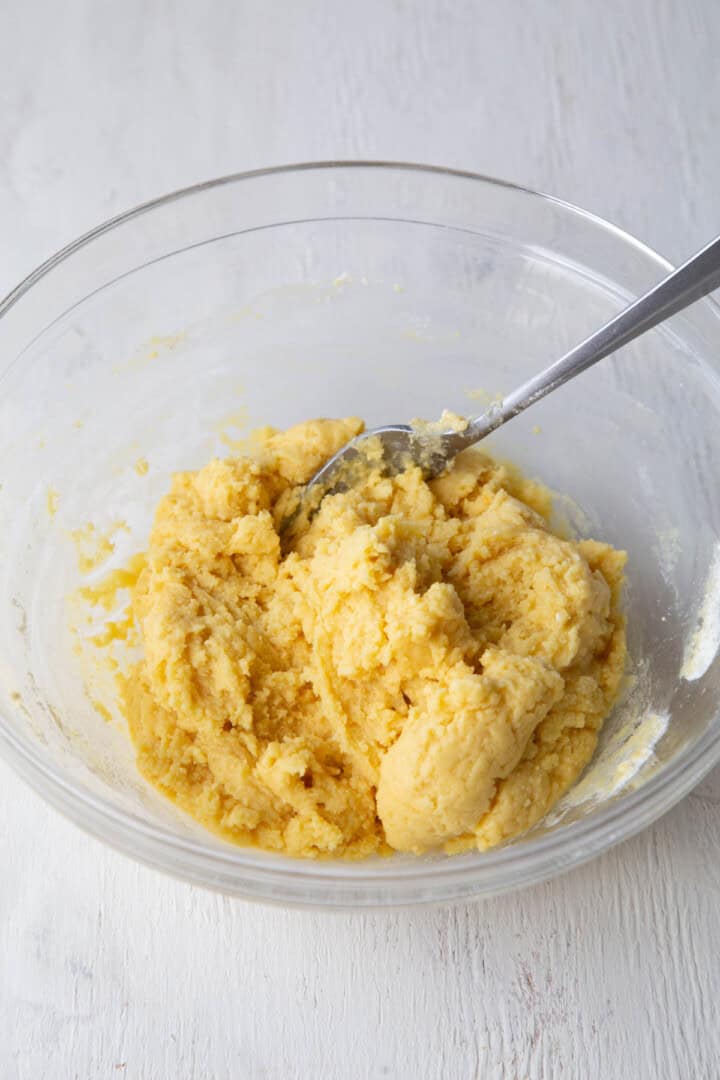 cake mix and butter in a glass bowl.