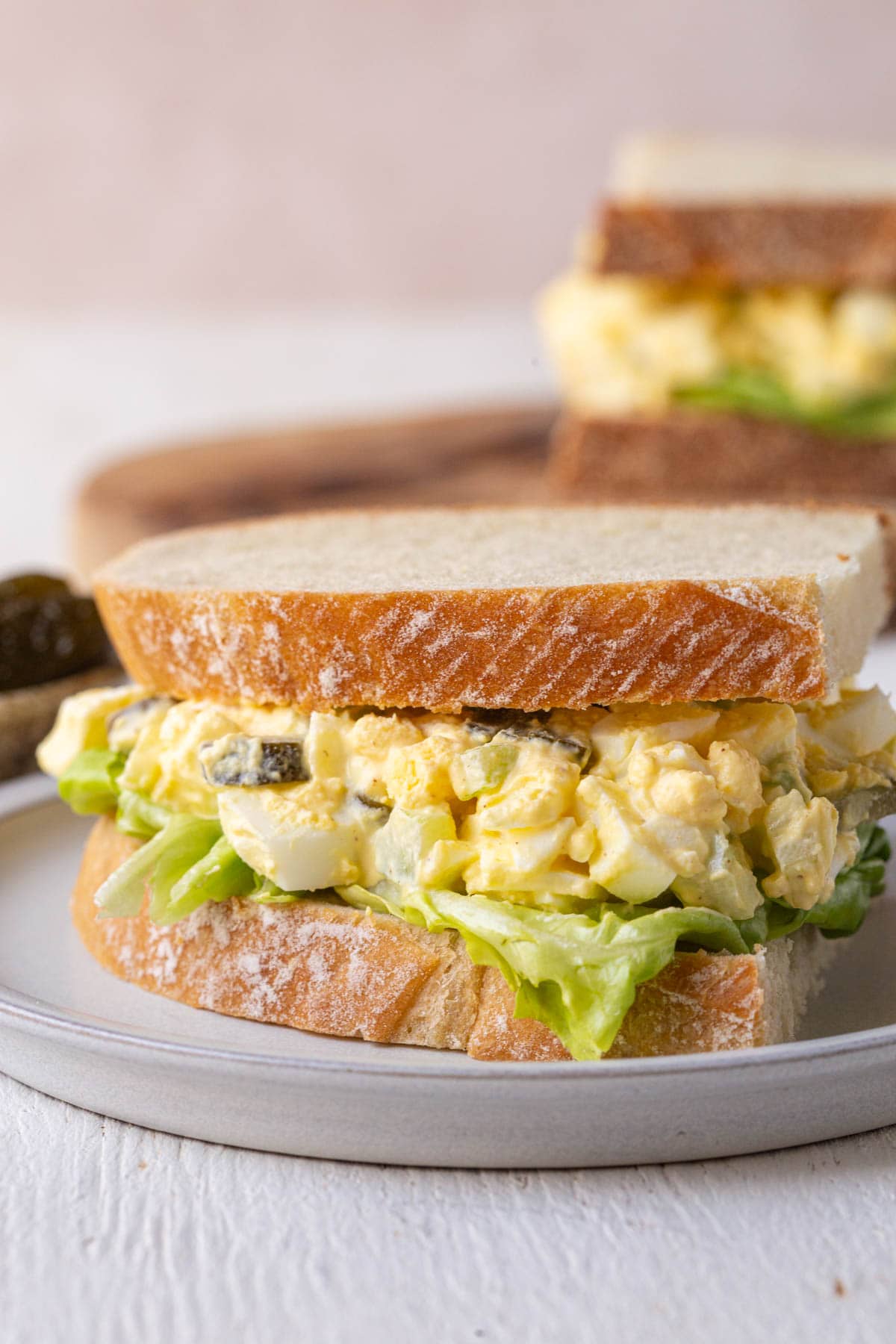 egg salad with pickles on sourdough bread.