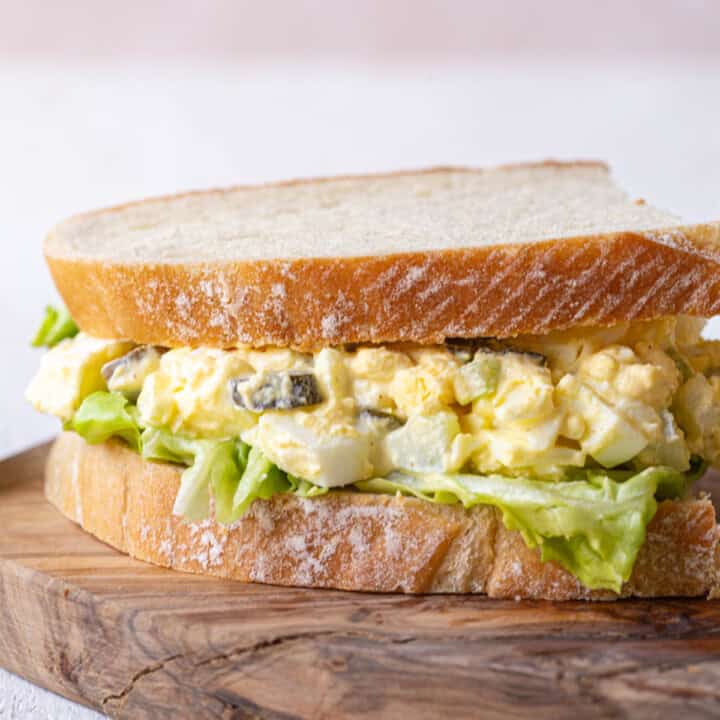 egg salad with pickles on sourdough bread.