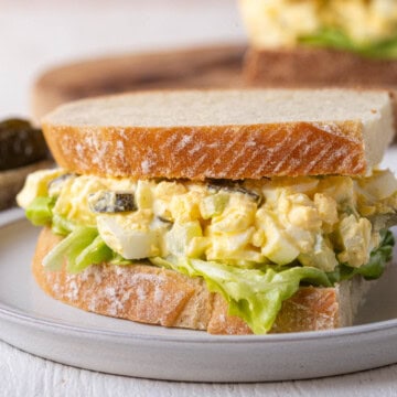 egg salad with pickles on sourdough bread.