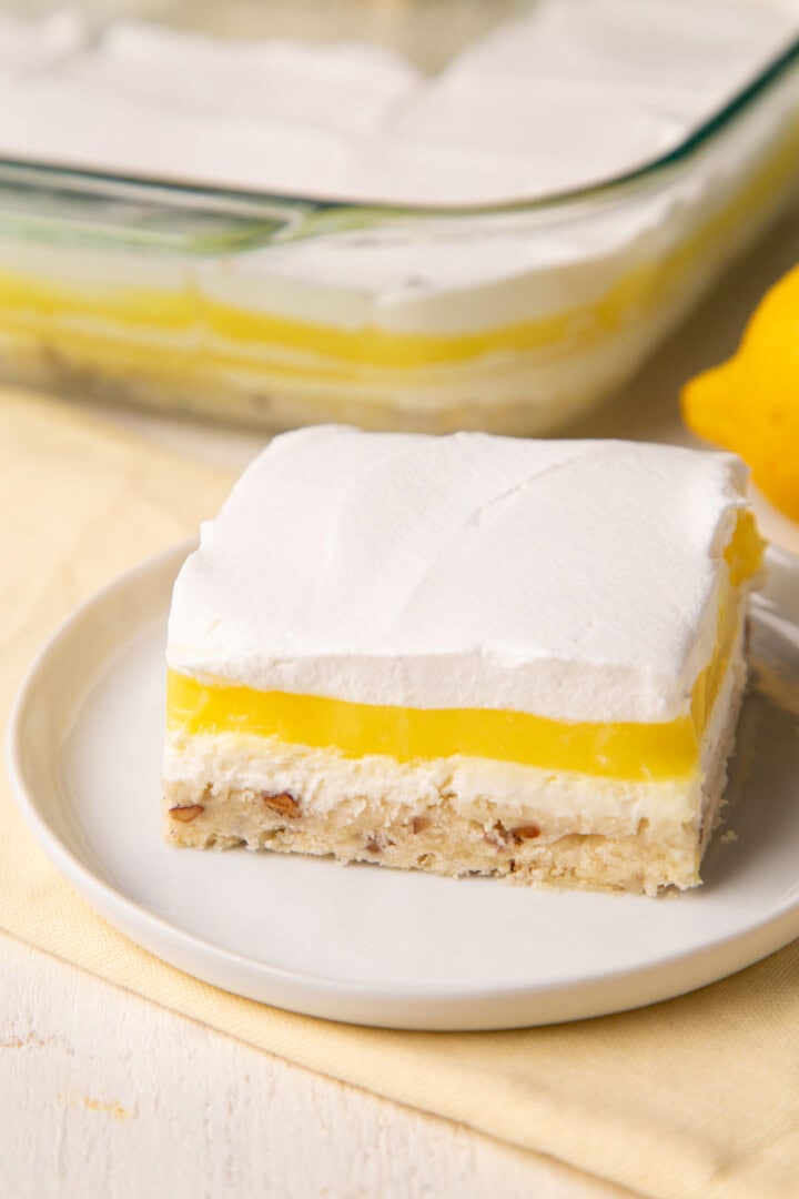 layered lemon pudding dessert on a white plate.