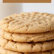 four peanut butter cookies stacked up.