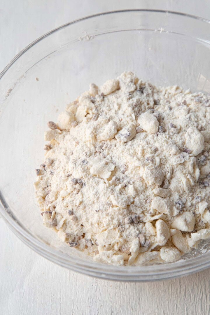 flour, pecans, and butter in a glass bowl.