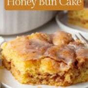 slice of honey bun cake with a bite taken out.