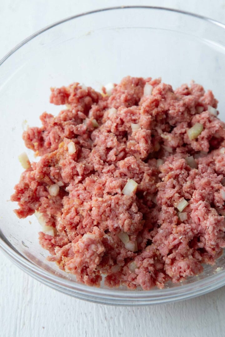 raw meat mixture in a glass bowl.